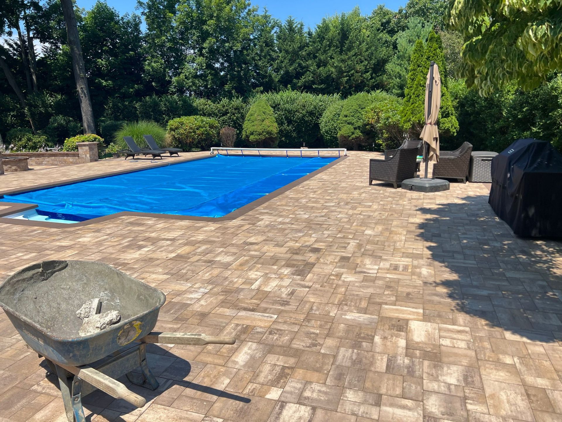 Tan paver pool deck installed by APM O'Neill & Sons in Suffolk County, Long Island
