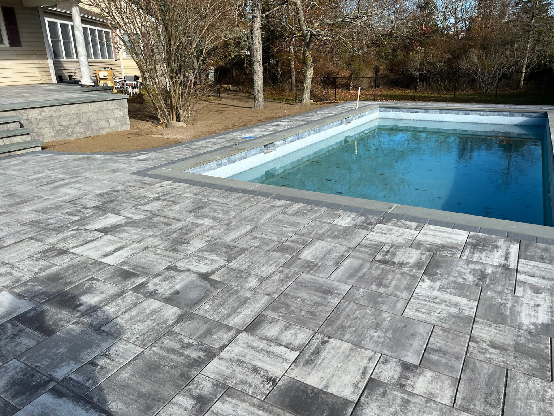 Techo-Bloc pool deck with charcoal border — Westhampton, NY