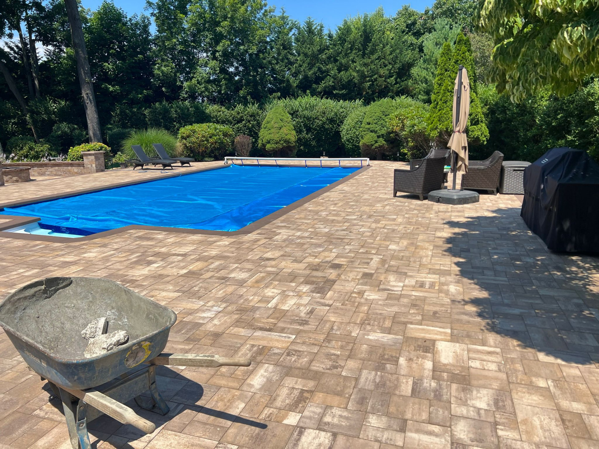 Wide Cambridge paver pool deck — Hamptons, NY